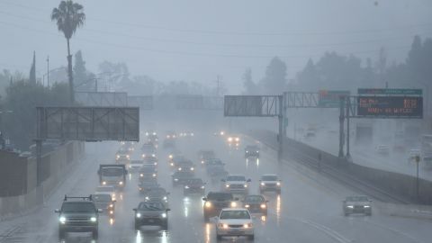 Commuters drive under heavy rainfall in Los Angeles, California on March 21, 2018 A slow-moving storm, billed as an "atmospheric river" began unleashing rain across southern California. Mandatory evacuations have been ordered by officials in Santa Barbara, Ventura and Los Angeles counties. / AFP PHOTO / Frederic J. Brown (Photo credit should read FREDERIC J. BROWN/AFP via Getty Images)