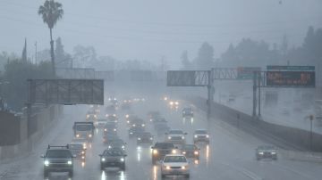 Commuters drive under heavy rainfall in Los Angeles, California on March 21, 2018 A slow-moving storm, billed as an "atmospheric river" began unleashing rain across southern California. Mandatory evacuations have been ordered by officials in Santa Barbara, Ventura and Los Angeles counties. / AFP PHOTO / Frederic J. Brown (Photo credit should read FREDERIC J. BROWN/AFP via Getty Images)