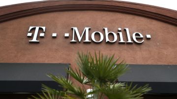 EL CERRITO, CA - APRIL 30: A sign is posted on the exterior of a T-Mobile store on April 30, 2018 in El Cerrito, California. T-Mobile announced plans to acquire Sprint for $26 billion to merge the two telecom companies. (Photo by Justin Sullivan/Getty Images)