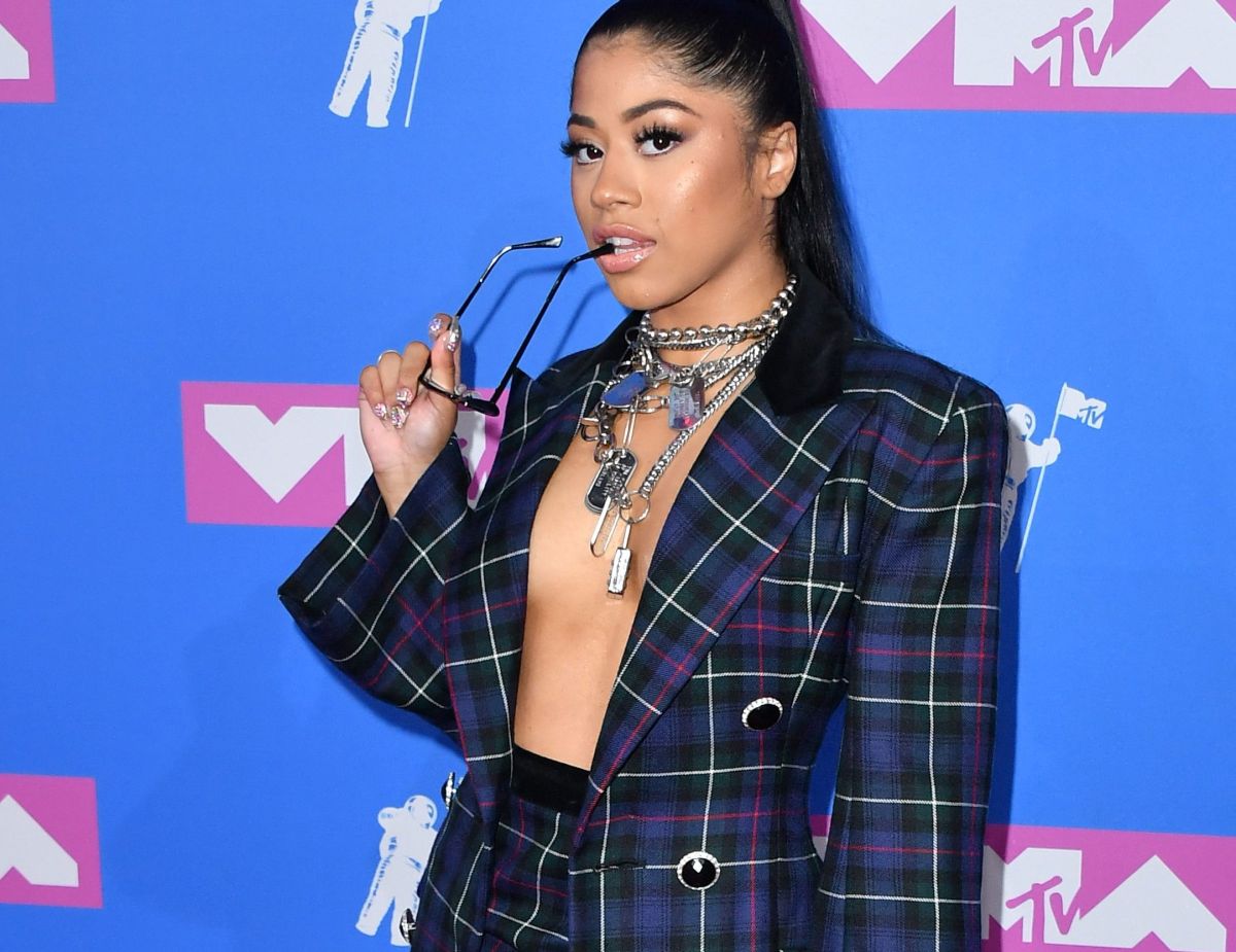 Cardi B’s sister Hennessy Carolina shows off her little trikini and leaves part of her breasts out