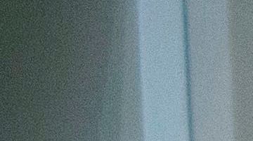 A nurse examines a patient not suspected to have Covid-19 in a former gift shop space converted into a patient examination area at Martin Luther King Jr. (MLK) Community Hospital on January 6, 2021 in the Willowbrook neighborhood of Los Angeles, California. - Deep within a South Los Angeles hospital, a row of elderly Hispanic men in induced comas lay hooked up to ventilators, while nurses clad in spacesuit-looking respirators checked their bleeping monitors in the eerie silence. The intensive care unit in one of the city's poorest districts is well accustomed to death, but with Los Angeles now at the heart of the United States' Covid pandemic, medics say they have never seen anything on this scale. (Photo by Patrick T. FALLON / AFP) (Photo by PATRICK T. FALLON/AFP via Getty Images)