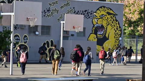 Students walk to their classrooms at a public middle school in Los Angeles, California, September 10, 2021. - Children aged 12 or over who attend public schools in Los Angeles will have to be fully vaccinated against Covid-19 by the start of next year, city education chiefs said September 9, 2021, the first such requirement by a major education board in the United States. (Photo by Robyn Beck / AFP) (Photo by ROBYN BECK/AFP via Getty Images)