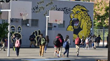 Students walk to their classrooms at a public middle school in Los Angeles, California, September 10, 2021. - Children aged 12 or over who attend public schools in Los Angeles will have to be fully vaccinated against Covid-19 by the start of next year, city education chiefs said September 9, 2021, the first such requirement by a major education board in the United States. (Photo by Robyn Beck / AFP) (Photo by ROBYN BECK/AFP via Getty Images)