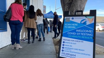 People line up at a Covid-19 testing tent at the corner of Third St and Fairfax Blvd, in Los Angeles, California, January 3, 2022. (Photo by VALERIE MACON / AFP) (Photo by VALERIE MACON/AFP via Getty Images)