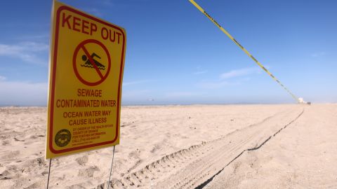 HUNTINGTON BEACH, CALIFORNIA - OCTOBER 03: A 'Keep Out' sign is posted near oil washed up on Huntington State Beach after a 126,000-gallon oil spill from an offshore oil platform on October 3, 2021 in Huntington Beach, California. The spill forced the closure of the popular Great Pacific Airshow with authorities urging people to avoid beaches in the vicinity. (Photo by Mario Tama/Getty Images)