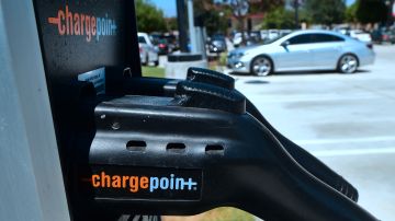 A non-electric vehicle fills a parking spot at a lot in Rosemead, California, where two Electric Vehicle charging stations are offered on September 12, 2018. - California Governor Jerry Brown signed a bill on September 10 pledging 100 percent clean electricity by 2045. (Photo by Frederic J. BROWN / AFP) (Photo credit should read FREDERIC J. BROWN/AFP via Getty Images)