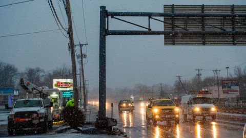 A utility crew works as snow starts to fall during winter storm Orlena in Saugus, Massachusetts on February 1, 2021. - The National Weather Service issued storm warnings from Virginia to Maine -- a swathe home to tens of millions of people -- and forecast snowfall of 18 to 24 inches (45-60 centimeters) in southern New York, northeastern New Jersey and parts of southwest Connecticut. (Photo by Joseph Prezioso / AFP) (Photo by JOSEPH PREZIOSO/AFP via Getty Images)