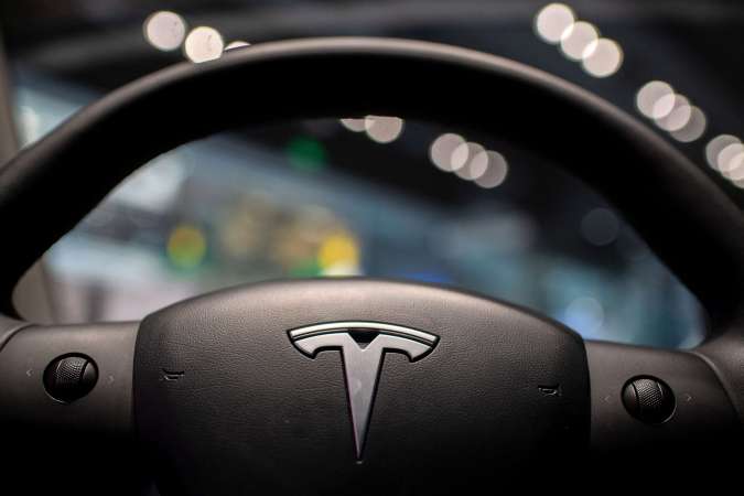 The inside of a Tesla car Model 3 is seen at a Tesla shop inside of a shopping Mall in Beijing on May 26, 2021. (Photo by NICOLAS ASFOURI / AFP) (Photo by NICOLAS ASFOURI/AFP via Getty Images)