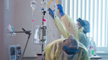 Nurses care for a Covid-19 patient inside the ICU (intensive care unit) at Adventist Health in Sonora, California on August 27, 2021. - The hospital has had 72 hospitalizations due to Covid-19 since August 1, 2021, of which 11 have died from complications of the virus. (Photo by Nic Coury / AFP) (Photo by NIC COURY/AFP via Getty Images)