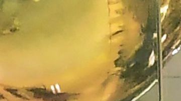 A shopping mall boutique sign requiring facemask for entry is pictured at a shopping mall in Santa Anita, California on December 20, 2021. (Photo by Frederic J. BROWN / AFP) (Photo by FREDERIC J. BROWN/AFP via Getty Images)