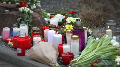 Flowers and candles are placed at a makeshift memorial at the scene of a crime on the campus of Heidelberg University, southwestern Germany, on January 25, 2022, one day after an attack by a gunman inside a lecture hall. - An 18-year-old student opened fire in a lecture hall at Heidelberg University in southwestern Germany on January 24, 2022, killing a young woman and injuring three others before fleeing the scene and turning the weapon on himself. (Photo by Daniel ROLAND / AFP) (Photo by DANIEL ROLAND/AFP via Getty Images)