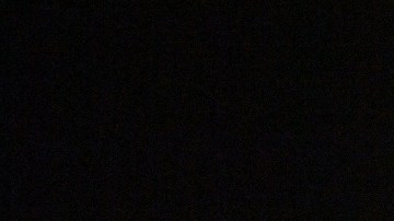 Fuegos artificiales con los aros olímpicos fuera del Estadio Nacional de Beijing.