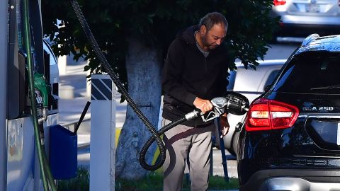 A man pumps gas into his vechicle at a petrol station in Montebello, California on February 23, 2022, as gas prices hit over $6 dollars per gallon. - Stock markets mostly rose and oil prices held relatively steady on February 23 as economic sanctions imposed on Moscow over the Russia-Ukraine crisis were deemed less harsh than expected. Brent crude stood at $96.73 per barrel, having soared to a seven-year high of $99.50 on February 22 on fears of disruptions to key Russian oil supplies. (Photo by Frederic J. BROWN / AFP) (Photo by FREDERIC J. BROWN/AFP via Getty Images)