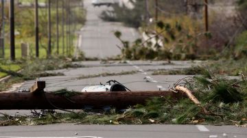 PASADENA, CA - DECEMBER 1: Fallen power poles block a street as strong Santa Ana Winds cause the worst local wind damage in decades on December 1, 2011 in Pasadena, California. As many as 230,000 were without power and the city of Pasadena closed schools and declared a state of emergency. (Photo by David McNew/Getty Images)