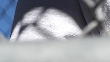 SAN QUENTIN, CA - AUGUST 15: A condemned inmate stands with handcuffs on as he preapres to be released from the exercise yard back to his cell at San Quentin State Prison's death row on August 15, 2016 in San Quentin, California. San Quentin State Prison opened in 1852 and is California's oldest penitentiary. The facility houses the state's only death row for men that currently has 700 condemned inmates. (Photo by Justin Sullivan/Getty Images)