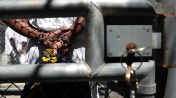 SAN QUENTIN, CA - AUGUST 15: A condemned inmate stands with handcuffs on as he preapres to be released from the exercise yard back to his cell at San Quentin State Prison's death row on August 15, 2016 in San Quentin, California. San Quentin State Prison opened in 1852 and is California's oldest penitentiary. The facility houses the state's only death row for men that currently has 700 condemned inmates. (Photo by Justin Sullivan/Getty Images)