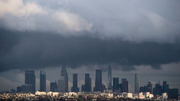 TOPSHOT - Rain clouds move over downtown Los Angeles, California on January 12, 2017. A series of storms that have rolled across California in the past week dumping heavy rain and snow could herald the end of a punishing historic drought, officials said. / AFP / Robyn BECK (Photo credit should read ROBYN BECK/AFP via Getty Images)