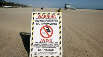 SANTA MONICA, CA - MAY 21: Signs warn beach-goers and swimmers not to enter the water, which could have unhealthy levels of bacteria emanating from a nearby drain, south of Will Rogers State Beach May 21, 2008 north of Santa Monica, California. A new annual beach report card by Heal the Bay indicates that ocean water quality has improved overall statewide - partly because lower than normal rainfall means less polluted run-off washing from storms drains - but the waters of Los Angeles County beaches remain the most bacteria-laden seawater in the state for the third straight year. Heal the Bay tests more than 500 locations on the California coast for daily and weekly fecal bacteria pollution levels. (Photo by David McNew/Getty Images)