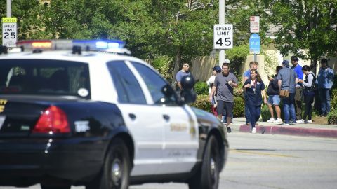 Police man an intersection May 11, 2018 following reports of shooting at Highland High School in Palmdale, 40 miles (65 kilometers) north of downtown Los Angeles. - Police arrested a man after reports of shootings at two schools near Los Angeles, the local sheriff's department and education officials said. The Los Angeles County Sheriff said one suspect had been detained "regarding the person with a gun" at Highland High School. Local news reports had earlier said that at least one person had been wounded. It was not immediately clear what type of weapon the man had. (Photo by Frederic J. BROWN / AFP) (Photo credit should read FREDERIC J. BROWN/AFP via Getty Images)