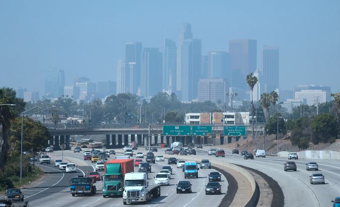 Highrise buildings in downtown Los Angeles, California are seen on on a hazy morning on September 21, 2018. - Eighty-seven days of smog this summer has made it the longest stretch of bad air in at least 20 years, according to state monitoring data, the latest sign Southern California's efforts to battle smog after decades of dramatic improvement are faltering. (Photo by Frederic J. BROWN / AFP) (Photo credit should read FREDERIC J. BROWN/AFP via Getty Images)