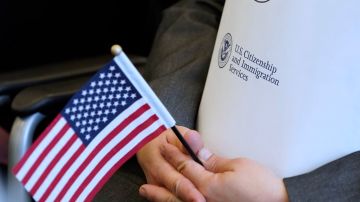 SALT LAKE CITY, UT - APRIL 10: An applicant holds an American flag and a packet while waiting to take the oath to become a U.S. citizen at a Naturalization Ceremony on April 10, 2019 in Salt Lake City, Utah. There were 49 people from 26 countries that became U.S. citizens. A group of Republican Senators are introducing a bill today to reduce legal immigration in the United States. (Photo by George Frey/Getty Images)