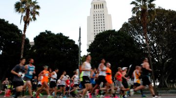LOS ANGELES, CALIFORNIA - MARCH 08: Runners make their way down 1st Street near City Hall during the 2020 Los Angeles Marathon on March 08, 2020 in Los Angeles, California. (Photo by Katharine Lotze/Getty Images)