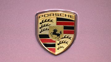 The Porsche logo is seen on a Porsche 718 Spyder car during the 19th Shanghai International Automobile Industry Exhibition in Shanghai on April 21, 2021. (Photo by Hector RETAMAL / AFP) (Photo by HECTOR RETAMAL/AFP via Getty Images)
