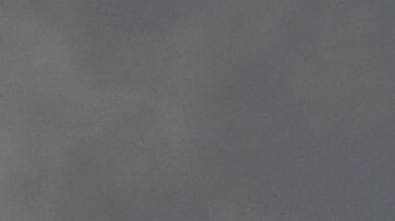 A Los Angeles Sheriff Department (LASD) Rescue 5 Super Puma helicopter circles over a burning house of a suspected gunman of a shooting at a fire station on June 1, 2021 in Acton, California. - A shooting at a fire station in Agua Dulce on Tuesday morning left one firefighter dead and another wounded, officials said. (Photo by Patrick T. FALLON / AFP) (Photo by PATRICK T. FALLON/AFP via Getty Images)