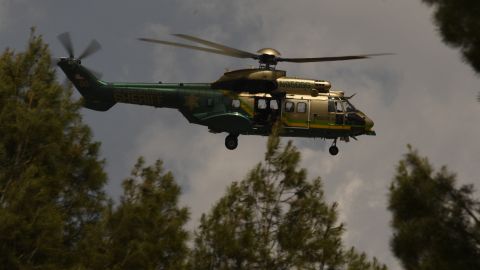 A Los Angeles Sheriff Department (LASD) Rescue 5 Super Puma helicopter circles over a burning house of a suspected gunman of a shooting at a fire station on June 1, 2021 in Acton, California. - A shooting at a fire station in Agua Dulce on Tuesday morning left one firefighter dead and another wounded, officials said. (Photo by Patrick T. FALLON / AFP) (Photo by PATRICK T. FALLON/AFP via Getty Images)