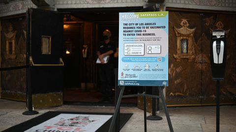 A sign outside the TCL Chinese Theatre informs visitors they must be vaccinated against Covid-19 to visit the popular tourist site, on December 1, 2021 in Hollywood. - The United States on December 1, 2021 announced its first confirmed case of the Covid-19 Omicron in California, in a fully vaccinated traveler who had recently returned from South Africa and was recovering from mild symptoms. (Photo by Robyn Beck / AFP) (Photo by ROBYN BECK/AFP via Getty Images)