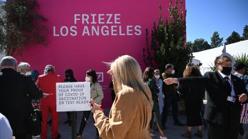 A sign demanding atendees to show proof of vaccination or Covid-19 negatif test is seen on the first day of Frieze Los Angeles, a leading international art fair, February 17, 2022 in Beverly Hills, California. - - (Photo by Robyn Beck / AFP) (Photo by ROBYN BECK/AFP via Getty Images)