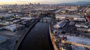 VERNON, CALIFORNIA - FEBRUARY 03: In an aerial view, the Los Angeles River flows near downtown L.A. on February 3, 2022 in Vernon, California. As climate change makes droughts more frequent and severe, concerns are growing among environmentalists that the 51-mile Los Angeles River could dry up. On most days of the year, 90 percent of the water flowing in the river has been discharged from wastewater treatment plants. Some cities along the river are aiming to increase wastewater recycling which would deprive the river of much of its water and threaten the river habitat. Los Angeles Mayor Eric Garcetti has pledged to have 100 percent of the city’s wastewater recycled by 2035. (Photo by Mario Tama/Getty Images)