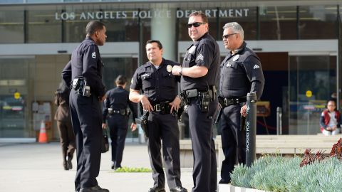 LOS ANGELES, CA - FEBRUARY 07: Los Angeles Police Department officers are deployed around the police headquarters on February 7, 2013 in Los Angeles, California. A former Los Angeles police officer Christopher Jordan Dorner, 33, who had allegedly warned he would target law enforcement, is suspected of firing on two LAPD officers and ambushing two other officers, killing one. Dorner is also a suspect in two weekend killings of Monica Quan and Keith Lawrence who were found dead in a car inside a parking structure. (Photo by Kevork Djansezian/Getty Images)