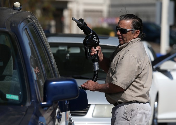 MILL VALLEY, CA - MARCH 03: A customer prepares to pump gasoline into his car at an Arco gas station on March 3, 2015 in Mill Valley, California. U.S. gas prices have surged an average of 39 cents in the past 35 days as a result of the price of crude oil prices increases, scheduled seasonal refinery maintenance beginning and a labor dispute at a Tesoro refinery. It is predicted that the price of gas will continue to rise through March. (Photo by Justin Sullivan/Getty Images)