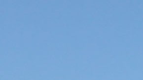 OAKLAND, CA - OCTOBER 28: California Highway Patrol officer Rick Baller stands next to his car as he guards the closed toll plaza leading to the San Francisco Bay Bridge October 28, 2009 in Oakland, California. The San Francisco Bay Bridge was abruptly closed Tuesday evening after two steel tie rods and a crossbeam from a steel saddle broke and fell onto the upper deck of the bridge landing on three vehicles and causing one person to suffer injuries. The eastern span of the bridge is undergoing seismic renovation and is expect to be completed in 2013. (Photo by Justin Sullivan/Getty Images)