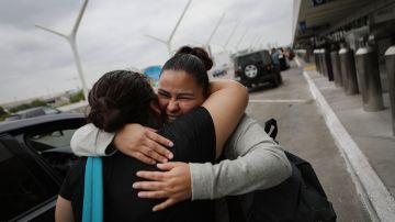 LOS ANGELES, CA - SEPTEMBER 02: An immigrant who identified herself only as Vioney (L), recently released after spending six months in an ICE detention facility, says goodbye to immigrant Martha (C) before both fly to be reunited with family members on September 2, 2018 in Los Angeles, California. Vioney, originally from Mexico, crossed the San Ysidro Port of Entry with three of her four children in February and asked U.S. authorities for asylum. She was separated from her three children the same day and held in detention until August 31. Her children, who are U.S. citizens, were immediately freed. A group of mothers known as Immigrant Families Together posted her bond, and she will remain in the country with her family while her case is adjudicated. (Photo by Mario Tama/Getty Images)
