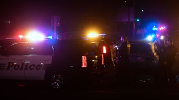 TOPSHOT - Police officers are seen at the intersection of US 101 freeway and the Moorpark Rad exit as police vehicles close off the area responding to a shooting at a bar in Thousand Oaks, California on November 8, 2018. - Twelve people, including a police sergeant, were shot dead in a shooting at a nighttclub close to Los Angeles, police said Thursday. All the victims were killed inside the bar in the suburb of Thousand Oaks late on Wednesday, including the officer who had been called to the scene, Sheriff Geoff Dean told reporters. The gunman was also dead at the scene, Dean added. The bar was hosting a college country music night. (Photo by Frederic J. BROWN / AFP) (Photo credit should read FREDERIC J. BROWN/AFP via Getty Images)