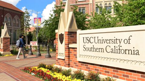 A student wears a facemask at the University of Southern California (USC) in Los Angeles, California on March 11, 2020, where a number of southern California universities, including USC, have suspended in-person classes due to coronavirus concerns. (Photo by Frederic J. BROWN / AFP) (Photo by FREDERIC J. BROWN/AFP via Getty Images)