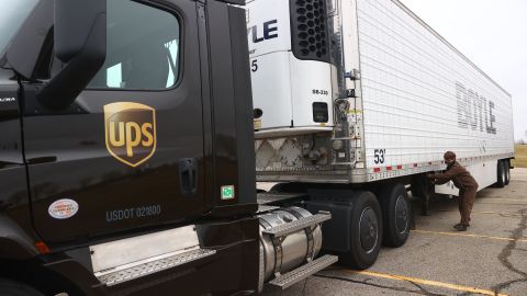 LANSING, MI - DECEMBER 13: A UPS worker hooks a UPS truck to a trailer containing shipments of the Pfizer And BioNTech COVID-19 vaccine at the Capital Region International Airport on December 13, 2020 in Lansing, Michigan. The first doses of the coronavirus (COVID-19) vaccine will be distributed to all 50 states. (Photo by Rey Del Rio/Getty Images)