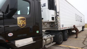 LANSING, MI - DECEMBER 13: A UPS worker hooks a UPS truck to a trailer containing shipments of the Pfizer And BioNTech COVID-19 vaccine at the Capital Region International Airport on December 13, 2020 in Lansing, Michigan. The first doses of the coronavirus (COVID-19) vaccine will be distributed to all 50 states. (Photo by Rey Del Rio/Getty Images)