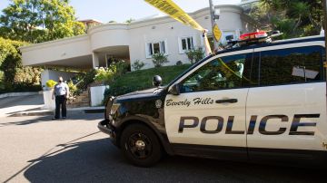 A Yellow Police tape blocks access to the 1100 block of Maytor place where Jacqueline Avant's house is at the top of the hill, in Beverly Hills , California on December 1, 2021. - The wife of the man known as the "Godfather of Black Music" was shot and killed Wednesday in a break-in at the couple's Beverly Hills home, US media reported. Jacqueline Avant died after being shot by a burglar, who also opened fire on a security guard, according to tabloid website TMZ. (Photo by VALERIE MACON / AFP) (Photo by VALERIE MACON/AFP via Getty Images)