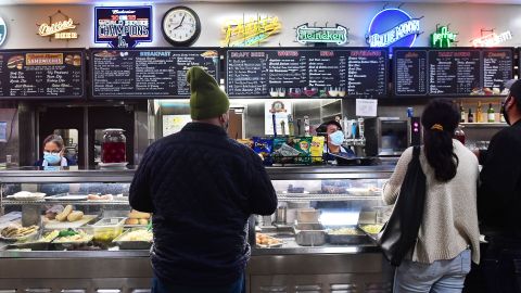 Servers take customer's orders at Philippe's, a downtown Los Angeles restaurant in business since 1908 famed for its "French Dipped Sandwich", in Los Angeles, California on December 10, 2021. - US consumer prices rose last month at a rate not seen in nearly 40 years, the government reported Friday, underscoring how inflation threatens the world's largest economy and President Joe Biden's public support. (Photo by Frederic J. BROWN / AFP) (Photo by FREDERIC J. BROWN/AFP via Getty Images)