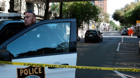 SACRAMENTO, CALIFORNIA APRIL 03: Police officers work the scene on the corner of 10th and L street of a shooting that occurred in the early morning hours on April 3, 2022 in Sacramento, California. Six people were killed and at least 10 were injured in the mass shooting in downtown Sacramento with no suspects in custody. (Photo by David Odisho/Getty Images)