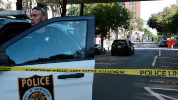 SACRAMENTO, CALIFORNIA APRIL 03: Police officers work the scene on the corner of 10th and L street of a shooting that occurred in the early morning hours on April 3, 2022 in Sacramento, California. Six people were killed and at least 10 were injured in the mass shooting in downtown Sacramento with no suspects in custody. (Photo by David Odisho/Getty Images)