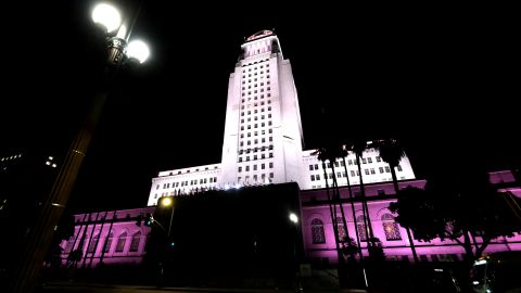 LOS ANGELES, CALIFORNIA - JANUARY 19: Los Angeles City Hall illuminates amber red to support the Biden Inaugural Committee's COVID-19 Memorial: A National Moment of Unity and Remembrance in {City, State} on January 19, 2021. The coronavirus (COVID-19) pandemic worldwide has claimed over 2 million lives and infected over 95.6 million people. on January 19, 2021 in Los Angeles, California. (Photo by Frazer Harrison/Getty Images)