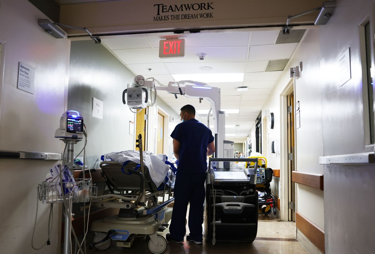 APPLE VALLEY, CALIFORNIA - MARCH 11: (EDITORIAL USE ONLY) A clinician cares for a patient in the Emergency Department at Providence St. Mary Medical Center on March 11, 2022 in Apple Valley, California. The hospital was treating 125 confirmed COVID-19 patients at the peak of the Omicron surge but has seen a sharp decline and is currently caring for 13 confirmed coronavirus patients. Today marks the two year anniversary of the World Health Organization’s official declaration of the COVID-19 pandemic. (Photo by Mario Tama/Getty Images)