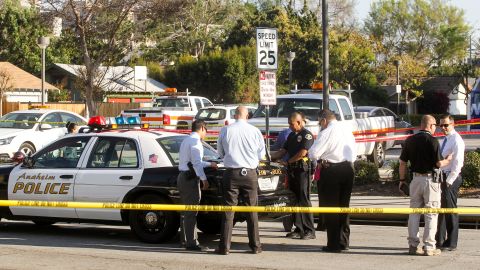 Police officers investigate the scene near Pearson Park in Anaheim, California, February 27, 2016, after three counter-protesters were stabbed while clashing with Ku Klux Klan members staging a rally. Thirteen people were arrested. / AFP / RINGO CHIU (Photo credit should read RINGO CHIU/AFP via Getty Images)