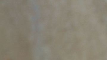 An ember burns under a car destroyed by the Clayton Fire in Lower Lake, California, August 15th, 2016. A northern California wildfire grew rapidly over the weekend, destroying homes and forcing 4,000 residents to flee, authorities said. / AFP / GABRIELLE LURIE (Photo credit should read GABRIELLE LURIE/AFP via Getty Images)