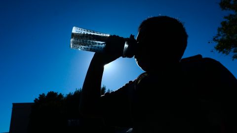 A child drinks from his water bottle amid an ongoing southern California heatwave in Los Angeles, California on June 26, 2017, where several heat records were set a day earlier. - The heatwave which began on June 6 is forecast to end on Tuesday June 27, 2017. (Photo by FREDERIC J. BROWN / AFP) (Photo credit should read FREDERIC J. BROWN/AFP via Getty Images)