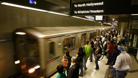 LOS ANGELES, CA - JUNE 3: Passengers wait for Metro Rail subway trains during rush hour June 3, 2008 in Los Angeles, California. Skyrocketing gas prices are driving more commuters to take trains and buses to work instead of their cars. In the first three months of 2008, the number of trips taken on public transport in the US rose 3 percent to 2.6 billion, creating pressures on some transportation systems to cope with increasing ridership. Transit officials in southern California and elsewhere are now encouraging employers to stagger employee schedules to ease the rush hour crunch on trains and buses and Metrolink plans to add 107 rail cars to its fleet of 155 as soon as next year. (Photo by David McNew/Getty Images)